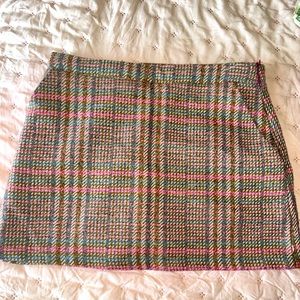 Never worn plaid mini skirt with pockets. Zipper on the side.